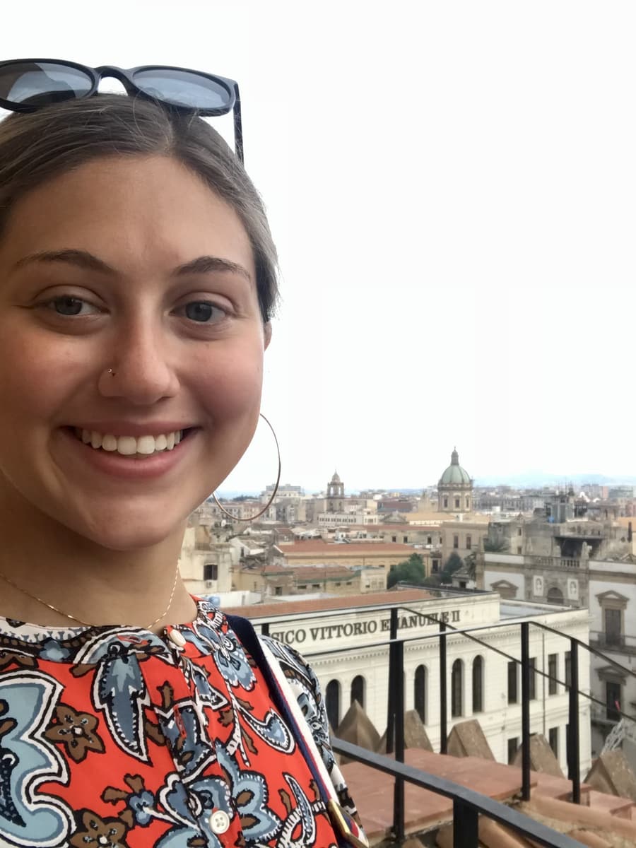 Juliana on a terrace above the rooftops in Sicily